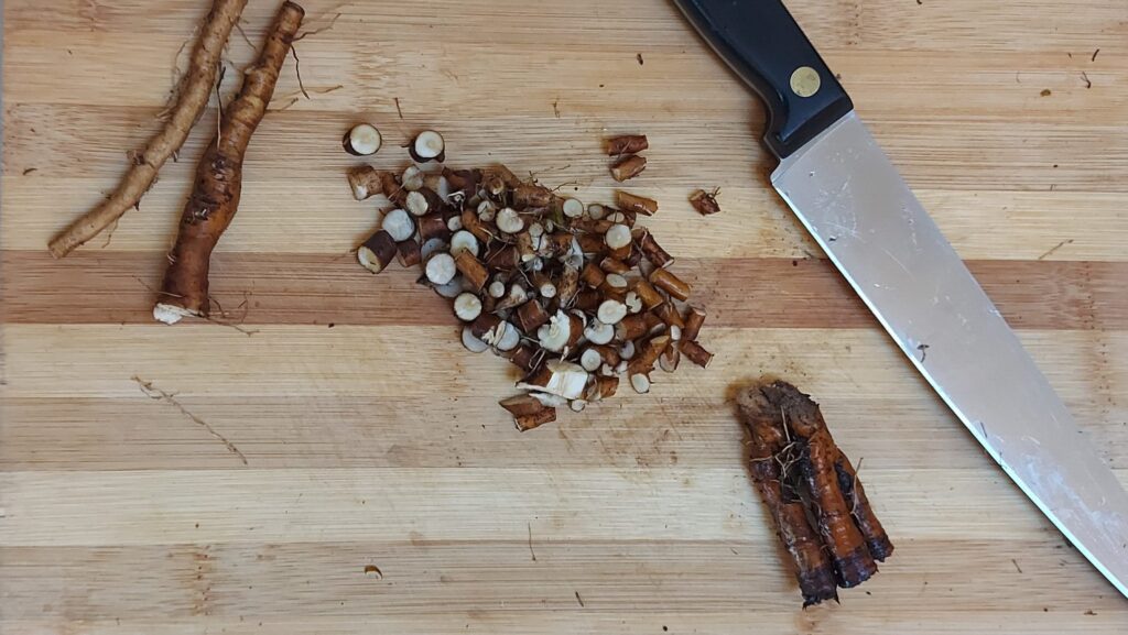 Chopped dandelion roots on cutting board